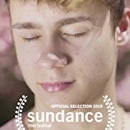 Jawline with extreme close Austyn Tester, with his eyes closed.up of