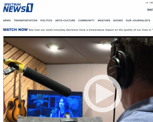 an image of a narrator with a headset looking at a video screen with a microphone