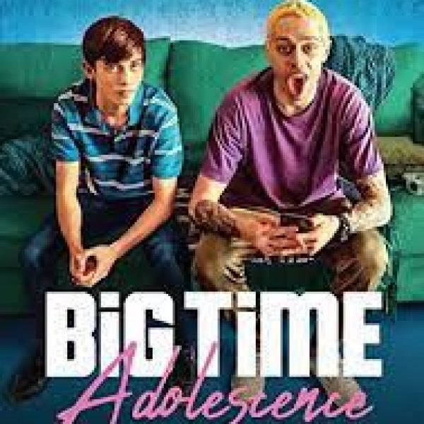 Two main characters sitting on a sofa over the title
