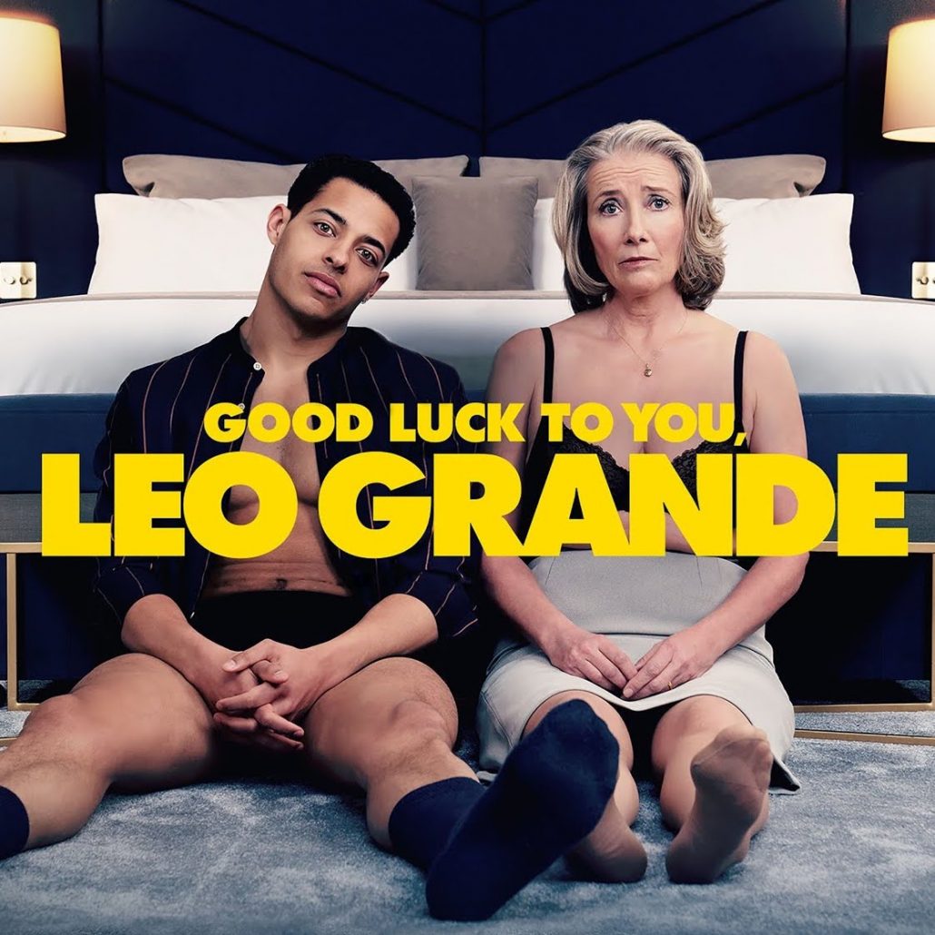 Man and Woman sitting in front of a bed behind the title